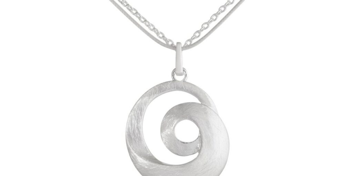 The Meaning Behind Spiral Necklaces: Symbolism, History, and Why Geometric Jewelry Matters